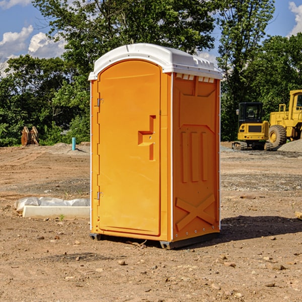 what is the cost difference between standard and deluxe portable restroom rentals in Akron IA